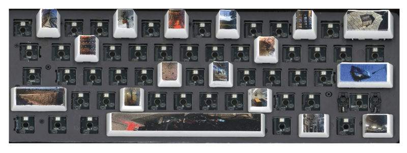 Photo of a keyboard with the keys replaced with images, most (of the keys) are taken out